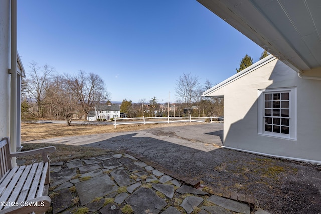 view of patio featuring fence