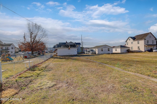 view of yard featuring a residential view and fence