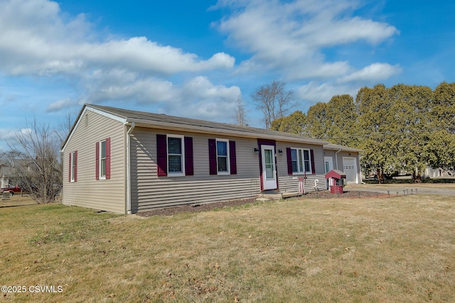 single story home with driveway, a front yard, and a garage