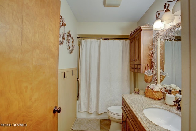 full bath featuring tile patterned floors, toilet, vanity, and shower / bathtub combination with curtain