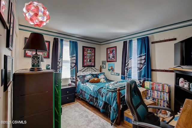 bedroom featuring wood finished floors