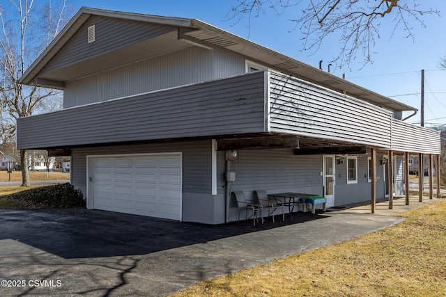 view of property exterior featuring driveway