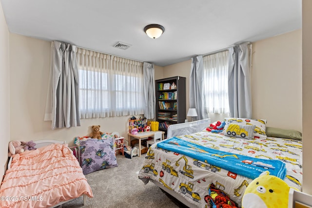 carpeted bedroom with visible vents