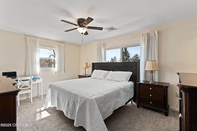 bedroom featuring baseboards, visible vents, carpet floors, and ceiling fan