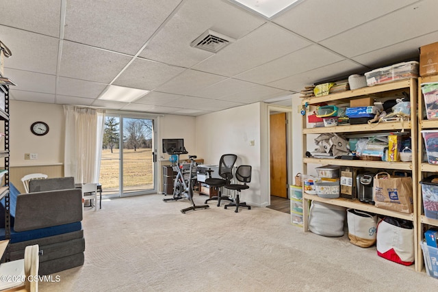 interior space featuring visible vents and a paneled ceiling