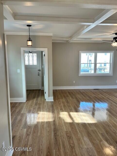 foyer entrance featuring wood finished floors, baseboards, coffered ceiling, beam ceiling, and ceiling fan