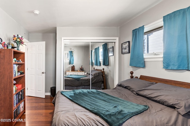 bedroom with a closet and wood finished floors