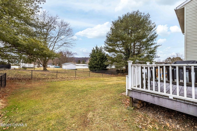 view of yard with fence and a wooden deck