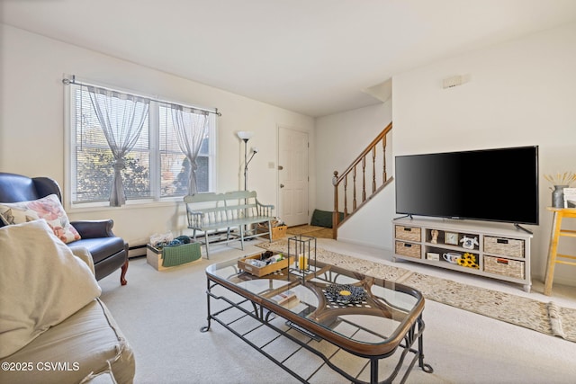 living room with stairs and carpet flooring