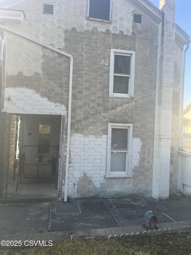 1035 W Walnut St, Coal Township, PA 17866 - rear view of house featuring stone siding and a chimney