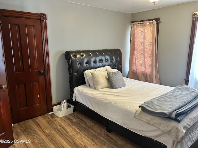 bedroom featuring wood finished floors