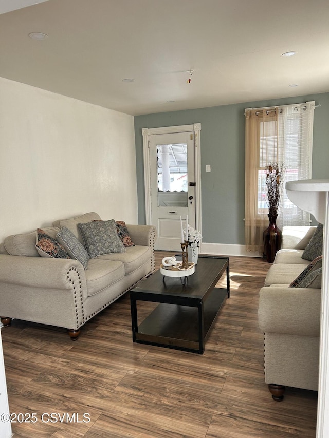 living room featuring wood finished floors and baseboards