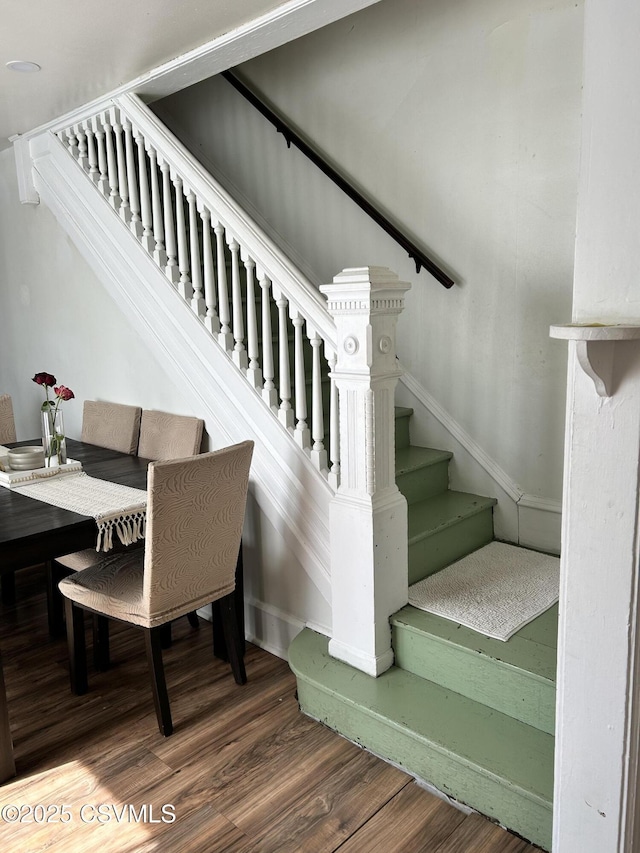 staircase with wood finished floors