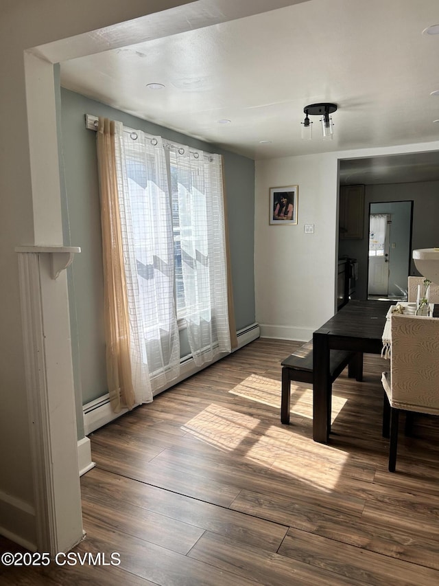 living room featuring baseboards and wood finished floors