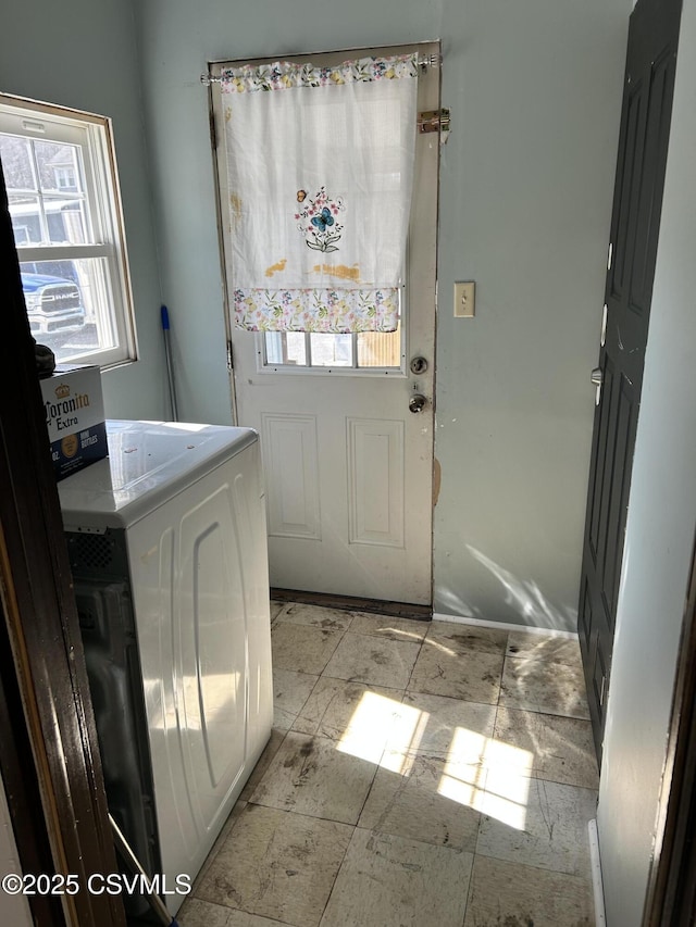 laundry area featuring washer / dryer and laundry area