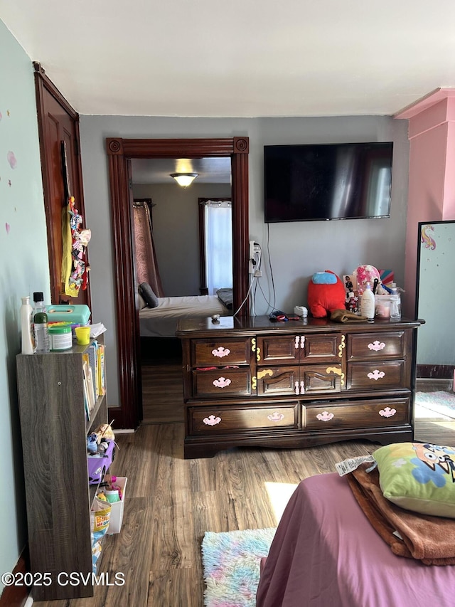 bedroom with wood finished floors