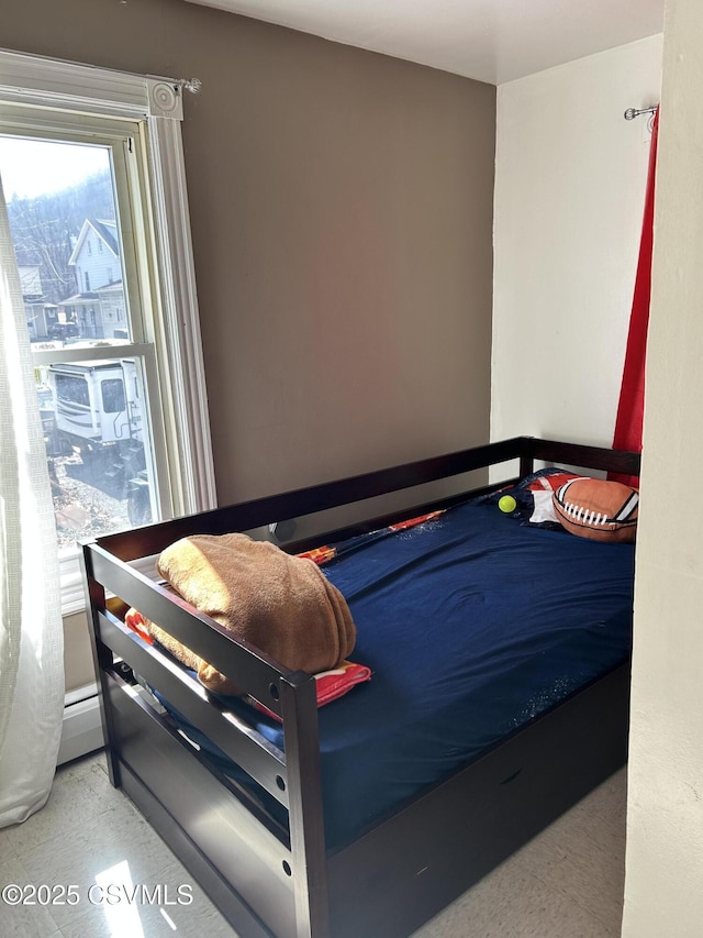 bedroom featuring a baseboard radiator