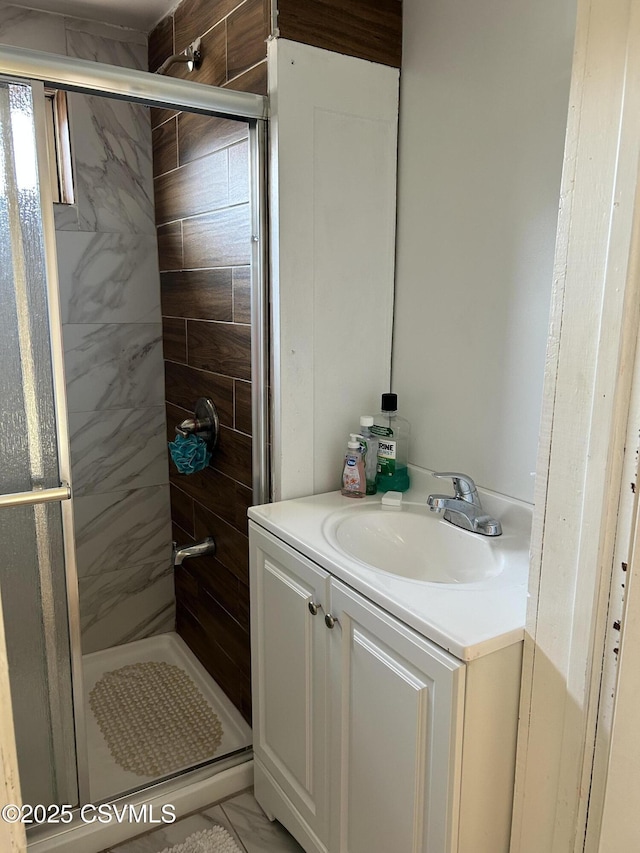 bathroom featuring vanity and a stall shower