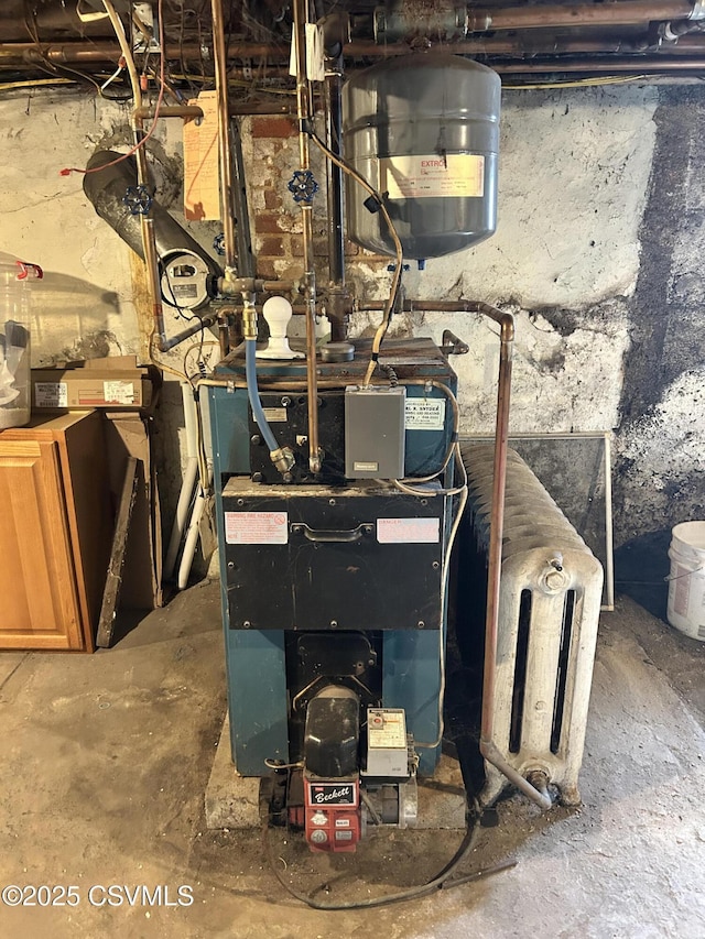 utility room featuring a heating unit