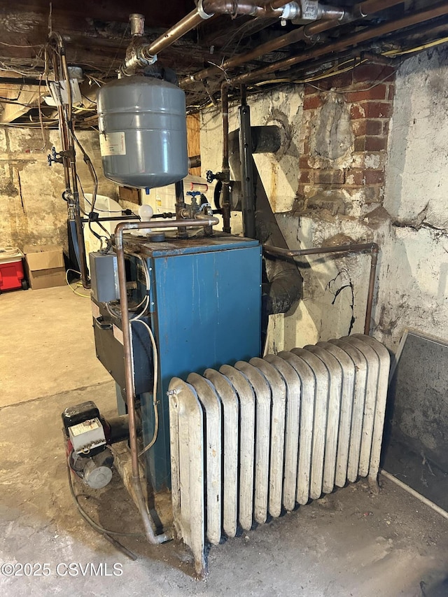 utility room featuring radiator