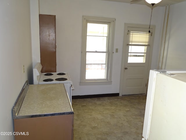 kitchen with white range with electric cooktop