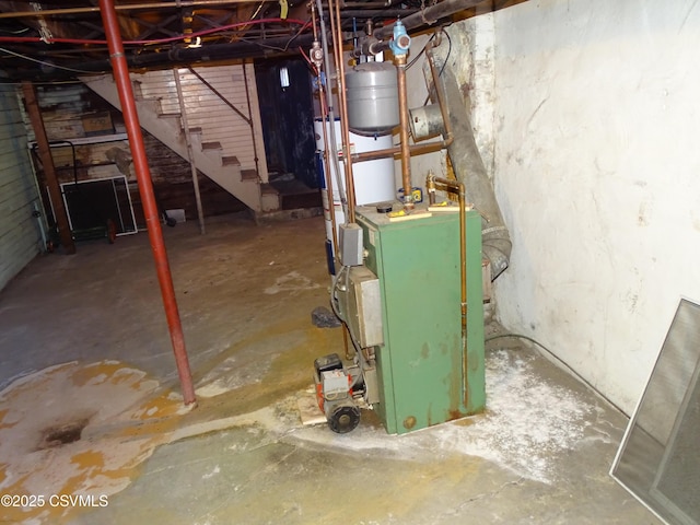 unfinished basement featuring a heating unit and stairs