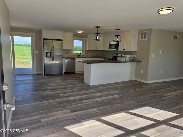 36 Starner Rd, Danville, PA 17821 - kitchen featuring stainless steel appliances, white cabinets, dark countertops, and baseboards