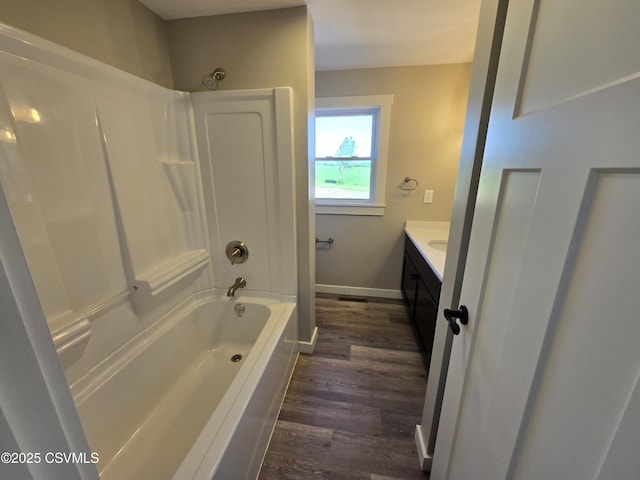 36 Starner Rd, Danville, PA 17821 - bathroom with vanity, wood finished floors, shower / bathtub combination, and baseboards