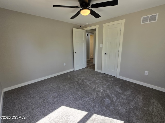 36 Starner Rd, Danville, PA 17821 - unfurnished bedroom with dark colored carpet, baseboards, and a ceiling fan