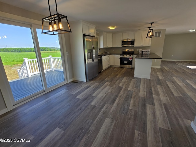 36 Starner Rd, Danville, PA 17821 - kitchen with stainless steel appliances, dark countertops, a sink, and white cabinets