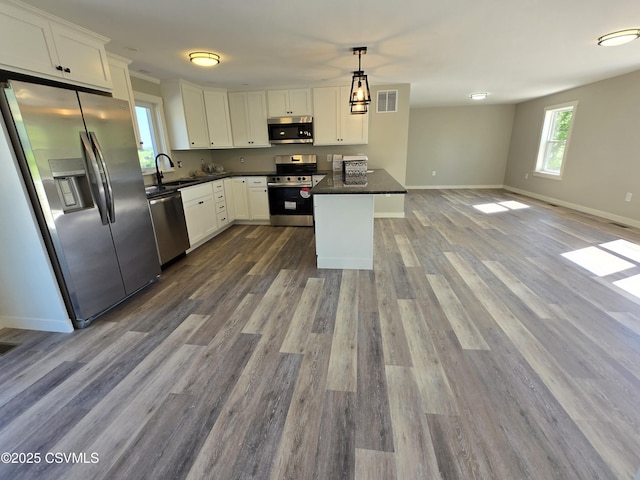 36 Starner Rd, Danville, PA 17821 - kitchen with appliances with stainless steel finishes, a sink, dark countertops, open floor plan, and white cabinets