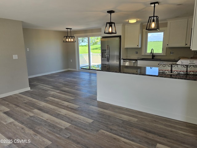 36 Starner Rd, Danville, PA 17821 - kitchen featuring appliances with stainless steel finishes, white cabinets, a sink, baseboards, and dark wood finished floors