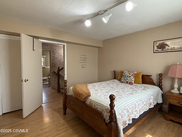 bedroom with light wood-type flooring