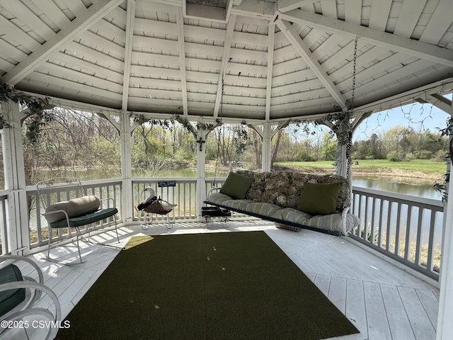 deck featuring a gazebo and a water view