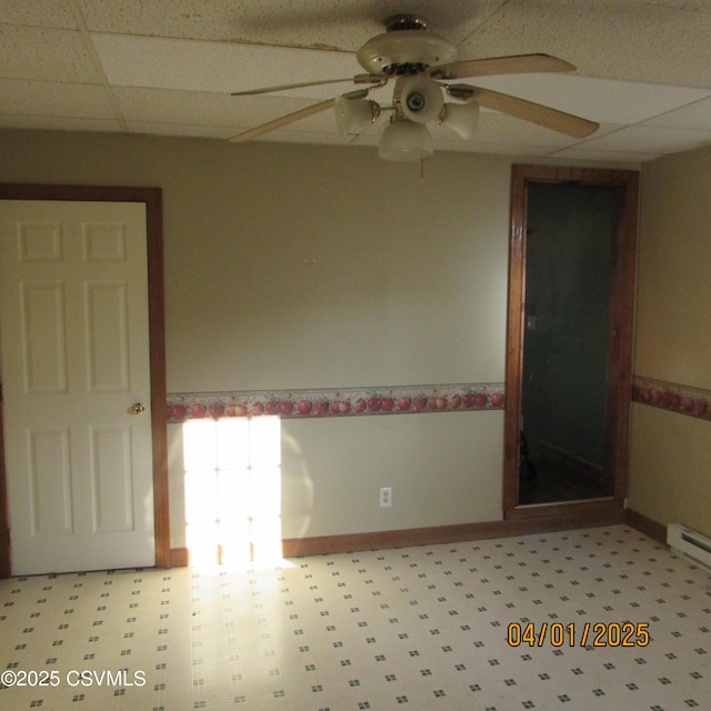 1017 Edison Ave, Sunbury, PA 17801 - unfurnished room with baseboards, a ceiling fan, and a paneled ceiling