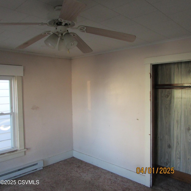 1017 Edison Ave, Sunbury, PA 17801 - unfurnished bedroom with baseboards, a ceiling fan, and a baseboard radiator
