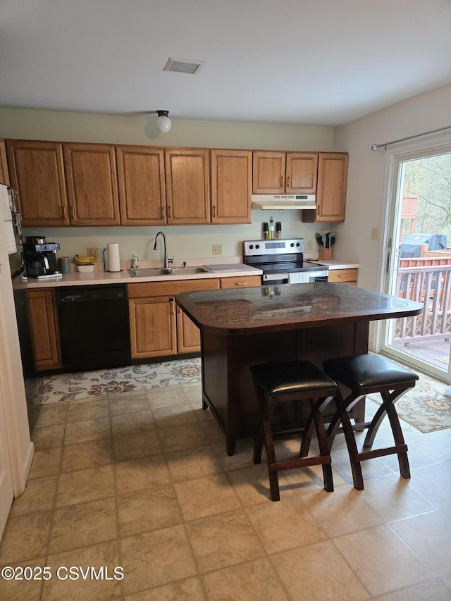 495 Meadow Ln, Danville, PA 17821 - kitchen with dishwasher, stainless steel electric range, under cabinet range hood, a sink, and a breakfast bar area