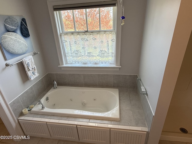 bathroom featuring a tub with jets
