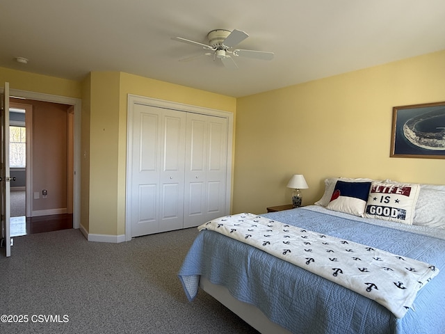bedroom with a closet, ceiling fan, baseboards, and carpet floors