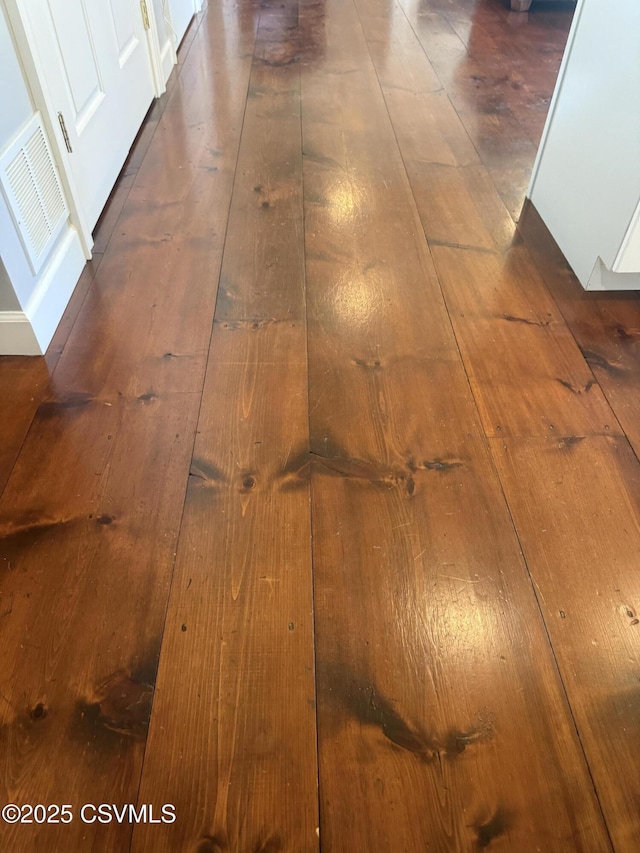 interior details featuring visible vents and wood finished floors