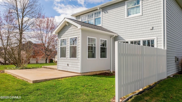 view of outbuilding featuring fence