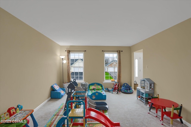 game room featuring carpet floors and baseboards