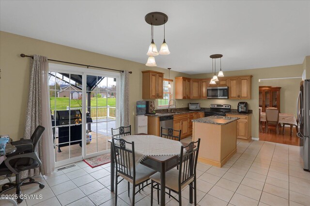 dining area with light tile patterned floors and visible vents
