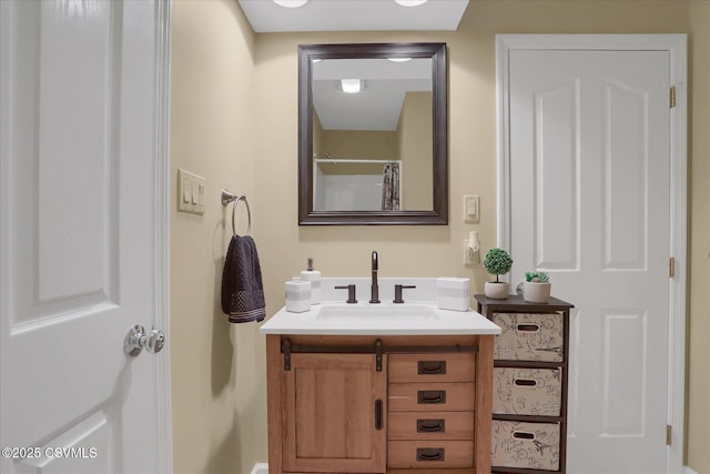 full bath featuring vanity and a shower with shower curtain