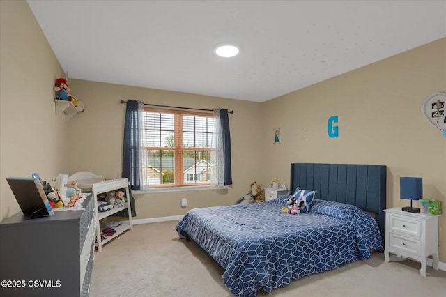 bedroom featuring carpet floors and baseboards