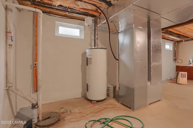 utility room with electric water heater and heating unit