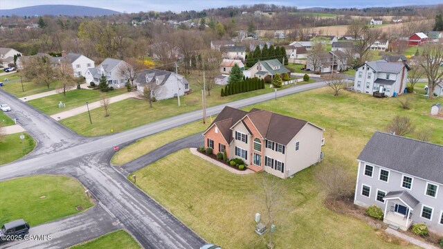 birds eye view of property with a residential view