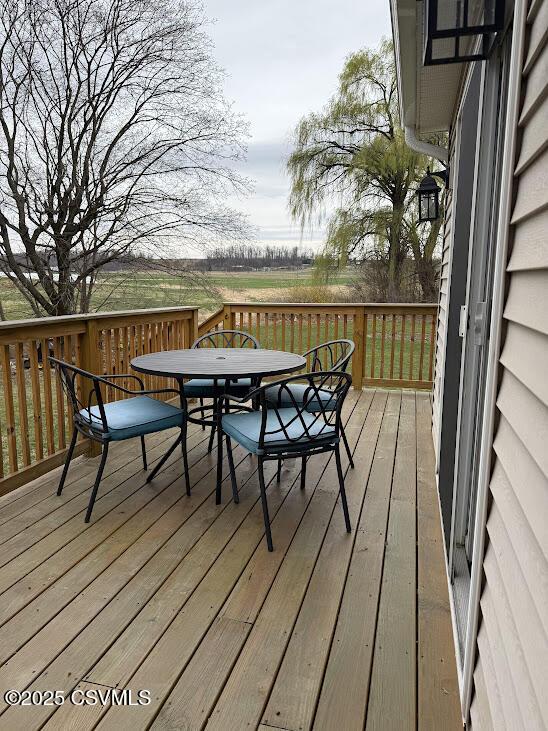 deck with outdoor dining space