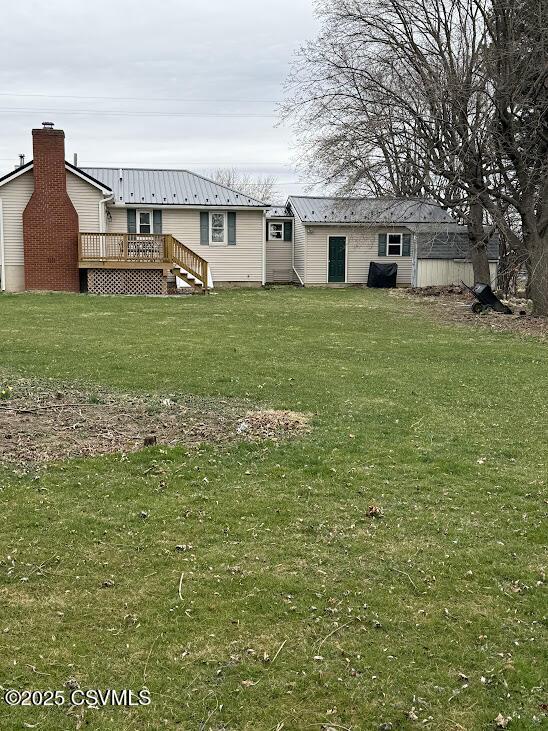 view of yard featuring a wooden deck