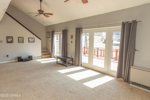 carpeted living area with ceiling fan, a textured ceiling, radiator heating unit, a baseboard heating unit, and lofted ceiling